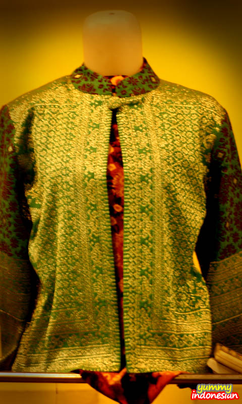 a woman's shirt made of songket